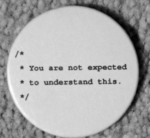 A badge showing the infamous “You are not expected to understand this” code comment from the sixth edition Unix kernel.