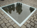 A memorial to all the books burned by the Nazis. It's impossible to stop people from standing on top of this thing, even though you can't see anything that way. I had meant to come back at night when it's illuminated underground, but it didn't happen.