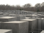 I think it evokes feelings of the city all the dead could fill, and the geometry of it reflects the technological way they were treated.
